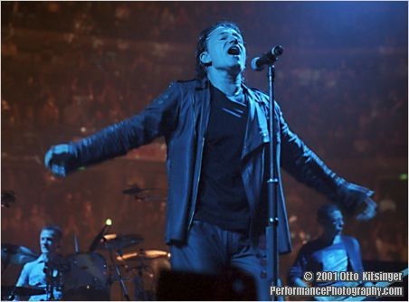 Live U2 concert photo of Larry Mullen Jr, Bono, Adam Clayton