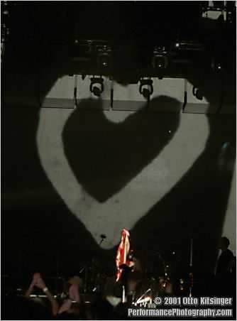 Live U2 concert photo of flag jacket and heart (inside suitcase)