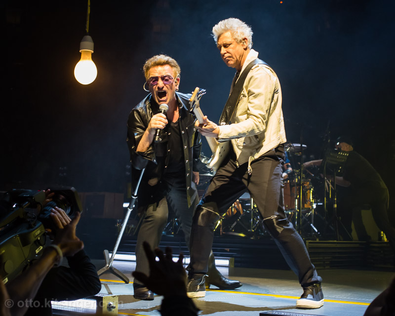 Live concert photo of Bono, Adam Clayton