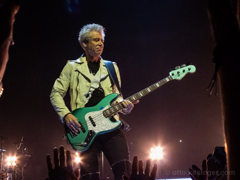 Live concert photo of Adam Clayton